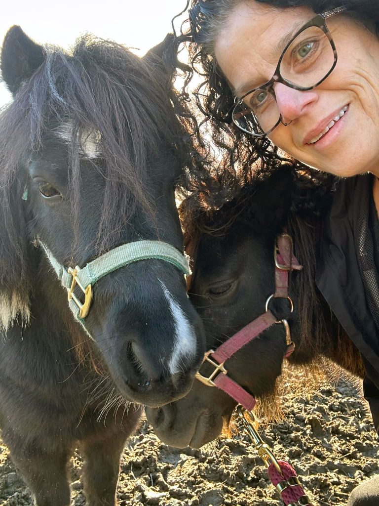 Niki Hoffman of Dark Horse with a dark-coloured horse.